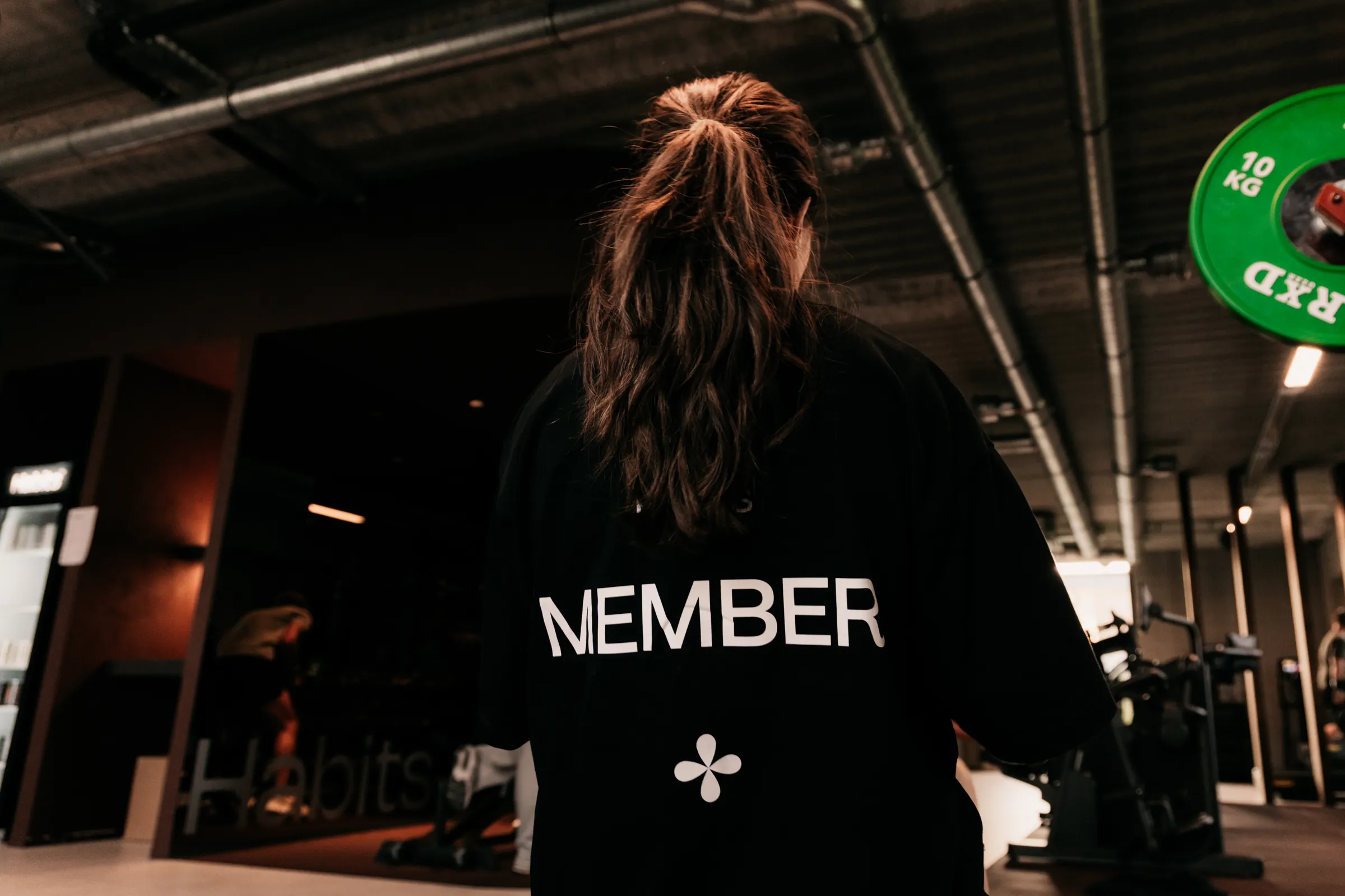 De club van Habits, met een lid en een coach aan het werk
